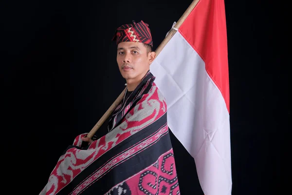 Man Wearing Traditional Woven Clothes Holding Indonesian National Flag Independence — Fotografia de Stock