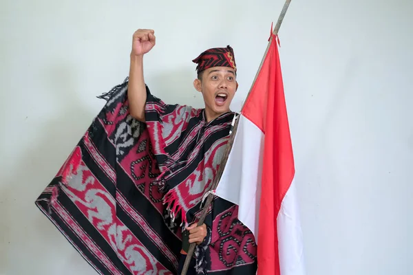 Man Wearing Traditional Woven Clothes Holding Indonesian National Flag Independence — Stockfoto