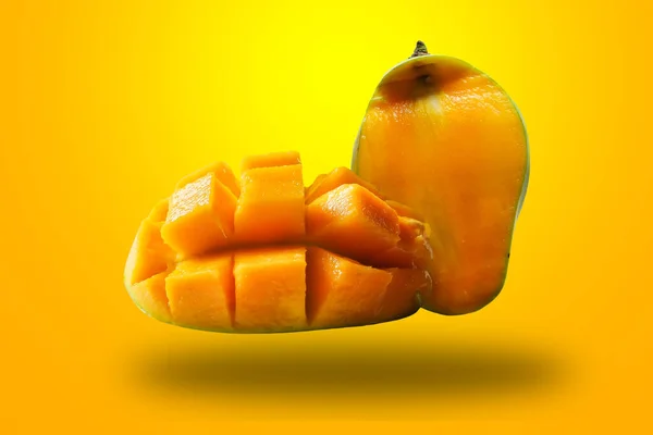 Ripe mango slices isolated on a yellow background. exotic fruit. clipping path