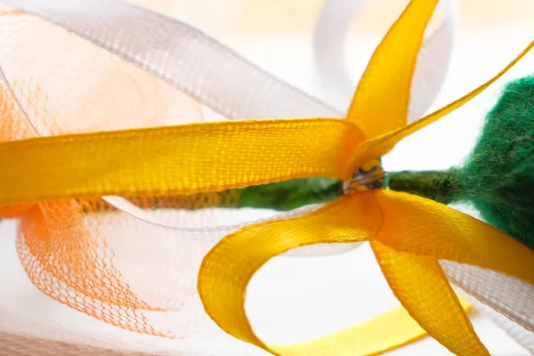 Soft yellow and white silk ribbon. Background image. Soft focus