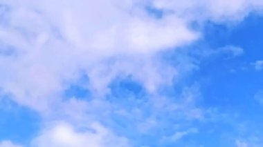 Blue skies and dense white clouds. Blue sky. A group of white clouds.