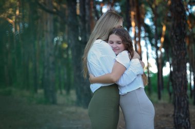 mother and daughter hugging. High quality photo