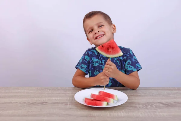 Child Looks Camera Holds Slice Watermelon Stick High Quality Photo — Stockfoto