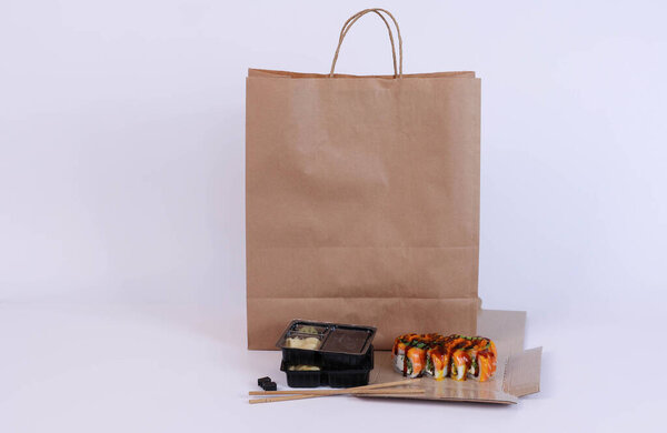 sushi delivery with carton package on white background. High quality photo