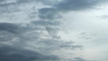 Grey rainy stormy clouds . Time lapse of dramatic moving dark clouds. Spectacular cloudscape. High quality 4k footage