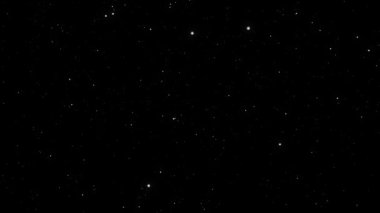 Siyah arkaplan üzerindeki yıldızlar ve parçacıklar soyut canlandırma.