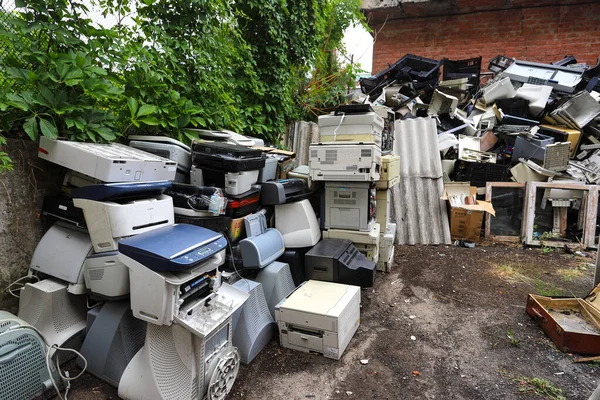 Old office equipment. E-waste devices consist of monitor, printer, desktop and fax, telephone, keyboard for reuse. Plastic, copper, glass can be reused. Environmental protection.