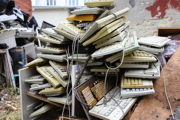 Old office equipment. E-waste devices consist of monitor, printer, desktop and fax, telephone, keyboard for reuse. Plastic, copper, glass can be reused. Environmental protection.