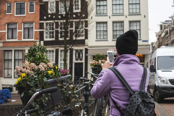 Girl Coat Backpack Takes Photo Smartphone Amsterdam City Young Woman — Stock Photo, Image