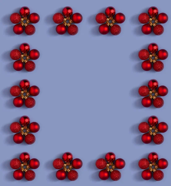 Layout celebrate Christmas red baubles background. Flat lay pattern with copy space. Minimal concept.