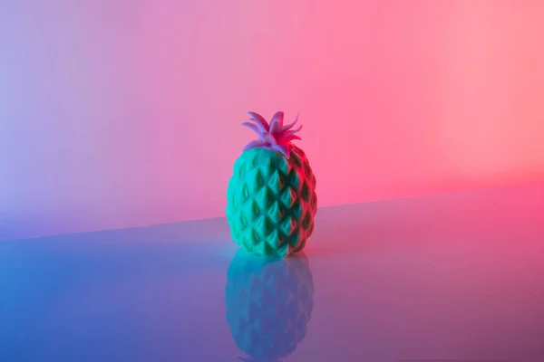Pineapple in vibrant bold gradient holographic colors. Minimal surrealism concept art.