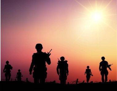 silhouettes of soldiers walking on the battlefield