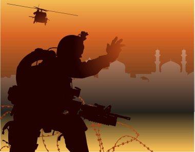 Kurtarma helikopteri bekleyen bir askerin silüeti. 