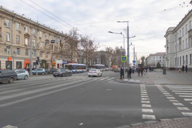 Chisinau, Moldova - December 25, 2021 people are waiting to cross the street at a traffic light