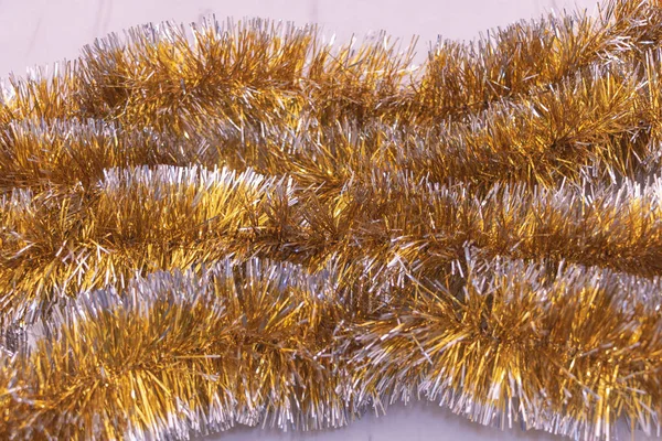 Крупный План Золотой Рождественской Мишуры Текстурой — стоковое фото