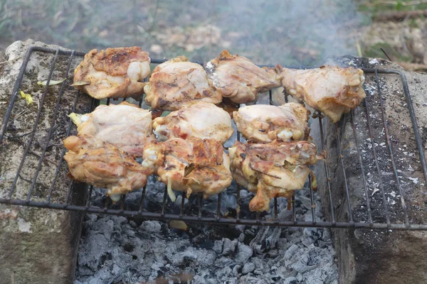 Close up shot of a few grilled skewers which are baking — Fotografia de Stock