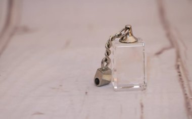 Closeup of jewelry perfume in white background.