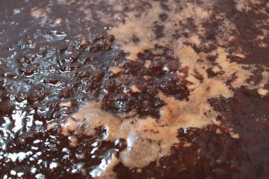 In the process of cooking sweet Plum jam close up - Recipe concept.