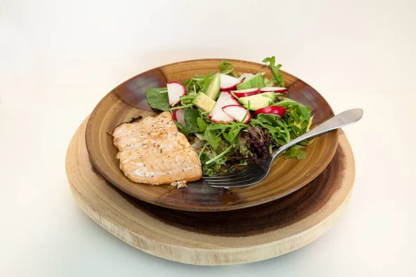 Isolated Healthy Dinner Salmon Spring Greens Salad Radishes Avocado — Zdjęcie stockowe