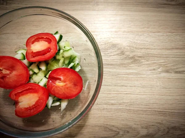 salad with tomatoes and tomato, white background.
