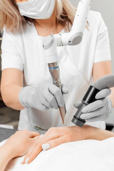 Hardware cosmetology. Young woman getting rf lifting procedure in a beauty parlour. — Stock Photo, Image
