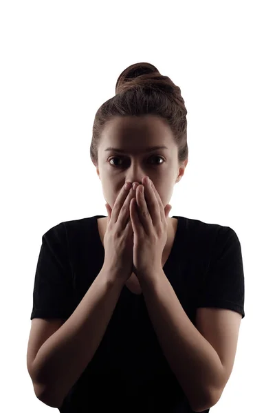 Silhouette di donna che ha chiuso la bocca a mano. Ritratto isolato su sfondo bianco — Foto Stock