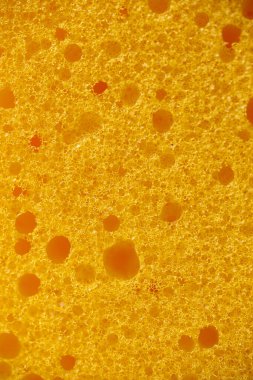 Sarı köpük kauçuk doku, gözenekli sentetik sünger, yakın plan..