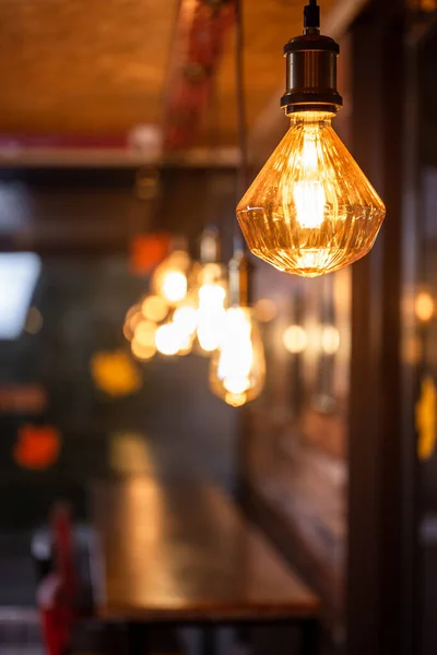 retro light bulb with warm light in a cafe.