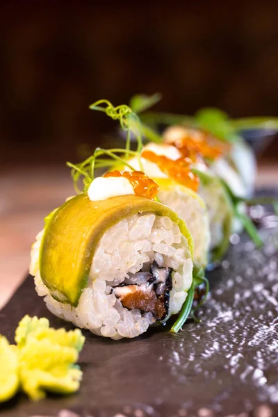 rice rolls with avocado and cheese japanese cuisine.