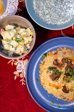 pilaf on a plate top view of the dining table.
