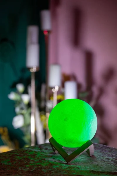 Moon lamp on the desktop in a dark room.