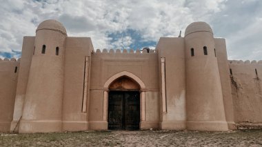 an old ancient castle in a deserted steppe in summer.