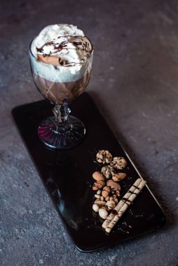 milkshake with cinnamon in a glass in a cafe.