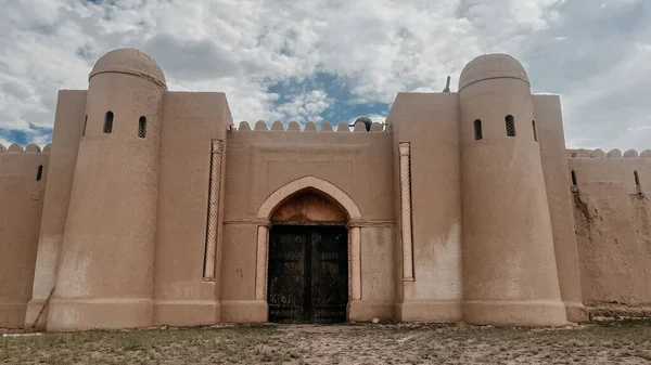 an old ancient castle in a deserted steppe in summer.