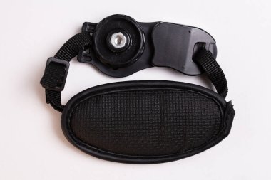 black leather camera strap on white background.
