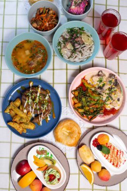 Top view of a table full of food in a cafe.