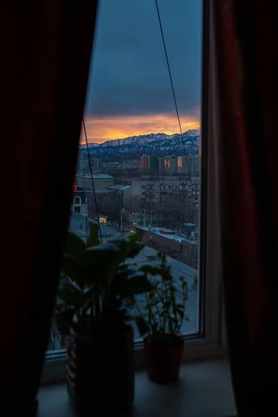 dawn of a winter morning view from the window to the mountains.