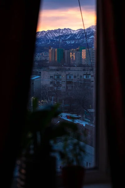 dawn of a winter morning view from the window to the mountains.