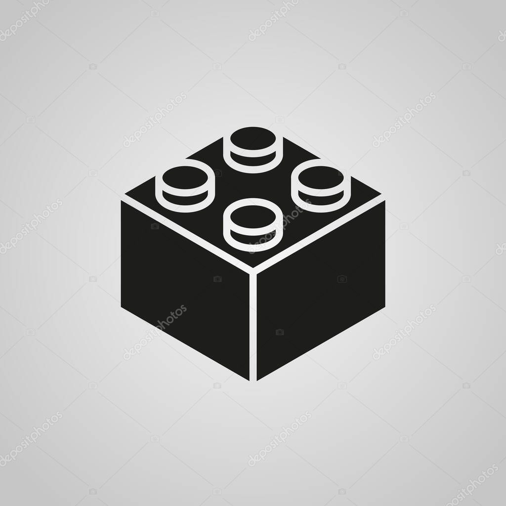 A black vector icon of a toy building block on gray background.