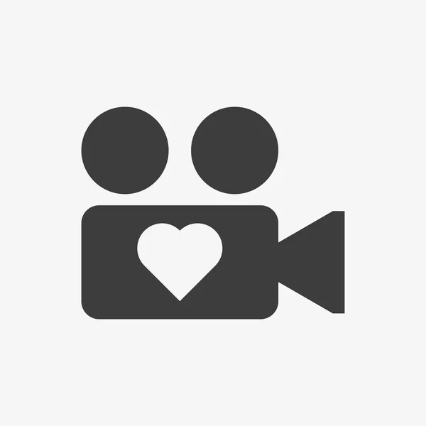 Cámara de vídeo con icono de vector de corazón. Cámara de amor — Vector de stock
