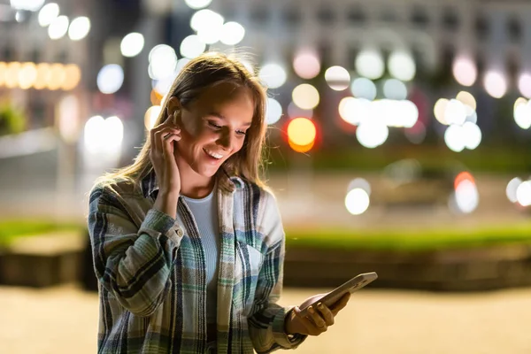 Smiling Young Woman Walking City Night Headphones Enjoy Listening Online Stock Image