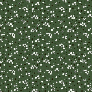 Koyu yeşil arka planda küçük beyaz çiçeklerden oluşan basit bir desen. Özgürlük stili. Çiçeksiz arka plan. Moda baskıları için zarif bir şablon.
