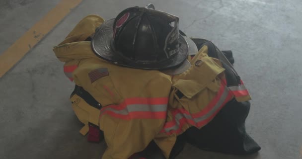 Firefighting Gear Waits Emergency Response Pile Fire Station — Stock Video