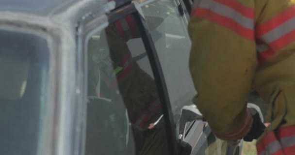 Firefighter Uses Lever Tool Break Open Car Window Accident — Stock Video