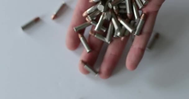 Dropping Bullet Shells White Surface — Stock Video