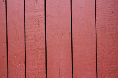 Eski, yıpranmış demir minyum boyalı, çitin dikey kalaslı kırmızı ahşap duvarı - kırsal tarz arka plan dokusu