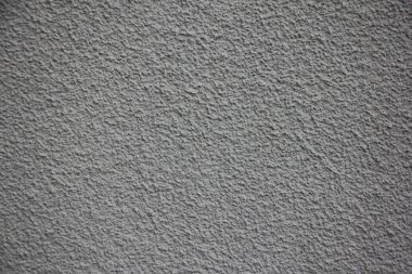 Eski gri boyanmış, desenli beton duvar dokusu arka plan. 