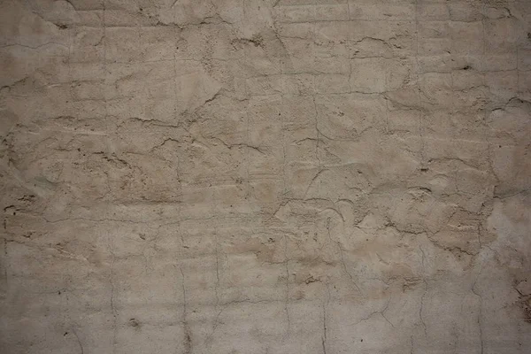 Gri, eski beton duvar dokusu rustik yüzey dokusu küçük çatlaklı çimento sıva yüzeyi.