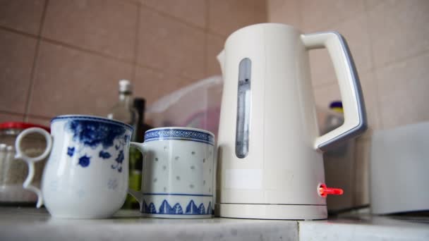 Person Pouring Boiled Water Tea Mugs Energy Use Cost Living — Stok video