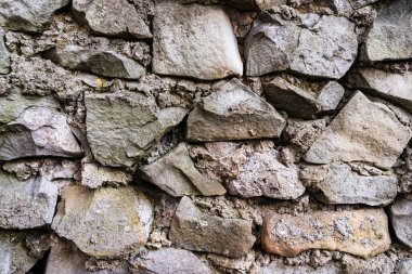 Taş bir duvarın dokusu. Eski kale taşından duvar dokusu. arkaplan veya doku için